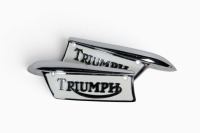 TRIUMPH: A pair of new Triumph tank badges to suit c1969 onwards, with screws [Location: Melbourne]