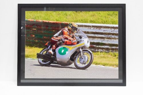 TOMMY ROBB: A very large poster of Tommy Robb racing Honda motorcycle, with signature possibly from Tommy Robb to lower left corner, 108cm high, 140cm wide overall [Location: Melbourne]