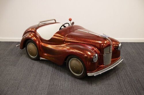 PEDDLE CAR: A 1950s steel bodied Austin J40 pedal car in hot rodded livery