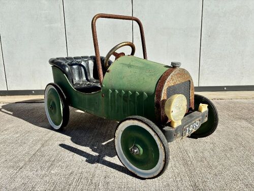 421 · PEDAL CAR: A vintage tin plate pedal car, 77cm length [Location: Sydney]