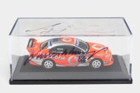 TOURING/SUPERCARS: Two 1:64 scale models, including Ford BA Falcon V8 Supercar #888 Vodafone model with case signed by Lowndes and Whincup, and a Matchbox #11 Castrol Racing VR Commodore - 3