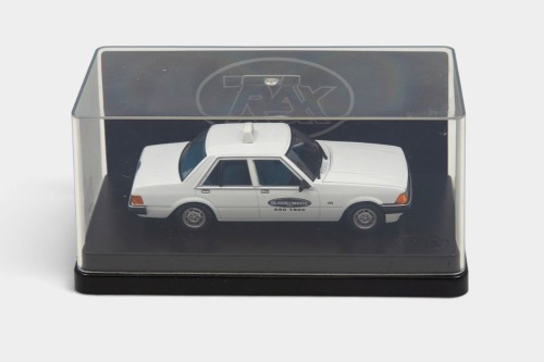 232 · XD FALCON: A Trax 1:43 scale Ford XD Falcon GL taxi model, finished in white paintwork bearing the Black & White taxis livery, part of the Aussie taxi series collection, model number TR84E