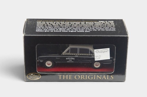 XK FALCON: A Trax 1:43 scale Ford XK Falcon sedan model, finished in white over black paintwork with the Black & White taxis livery, part of the Aussie taxi series of models, model number TR26H