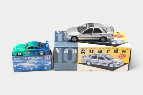 MODELS: Two scale models, including a 1:60 scale Tomica Nissan Skyline GT-R R33 in Falken livery, along with a Corgi Vanguards Ford Sierra Sapphire Cosworth 4x4