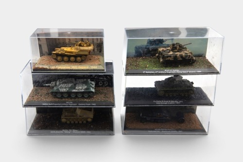 MODEL TANKS: A group of six model tanks, believed to be 1:72 scale, each within acrylic cases