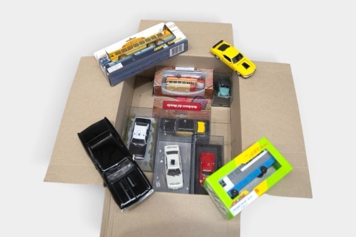 MODELS: A mixed grouping of ten diecast model vehicles, including two James Bond magazine model cars, a 1:24 scale Maisto Chevelle, two model busses a 1:64 scale 'Columbia Icefield' Snocoach bus and four other various model cars
