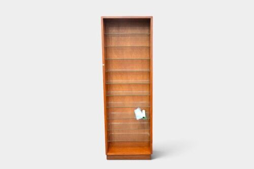 CABINET: A western red cedar timber and glass-shelved tall display cabinet, measures 242cm high, 80cm wide, 28.5cm deep overall