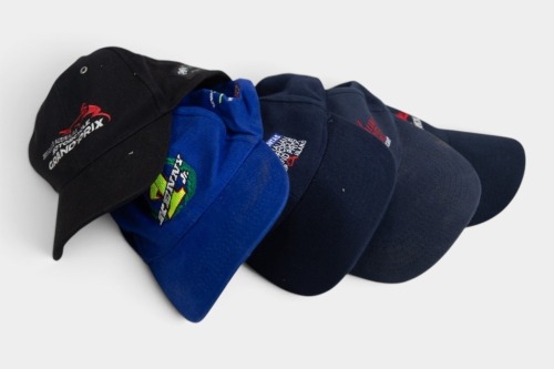 170 · HATS: A group of five motorcycle racing event hats [Location: Melbourne]