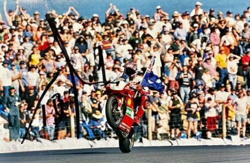 TROY BAYLISS: An unframed signed original photograph by motorsport photographer John Morris [Location: Sydney]