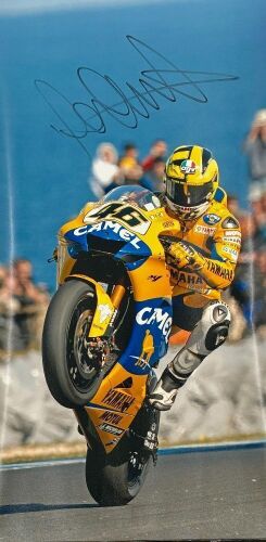 VALENTINO ROSSI: An unframed signed original photograph by motorsport photographer John Morris [Location: Sydney]