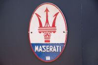 MASERATI: A modern cast iron oval shaped Maserati sign, 30cm high, 20cm wide