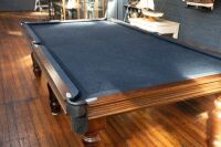 POOL TABLE: A pool / billiard table complete with triangles, pool balls, billiard balls, scoreboard, overhead lamp, cues & cue rack and table cover, thought to a nine foot tournament sized table - 13