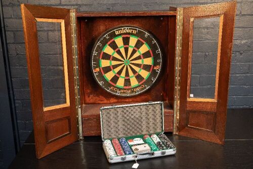 DARTBOARD / CASINO: A dartboard game fitted in timber case, with two opening doors & one drawer for darts, case 80cm high, 60cm wide, 22cm deep together with a casino kit