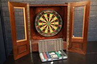 DARTBOARD / CASINO: A dartboard game fitted in timber case, with two opening doors & one drawer for darts, case 80cm high, 60cm wide, 22cm deep together with a casino kit