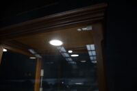 DISPLAY CASE: A tall display case, has timber frame, glass walls, four glass shelves, lockable door, on castors, 188cm high, 65cm wide, 49cm deep - 3