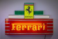 FERRARI: A Ferrari neon light fixture with front badge style Ferrari sign affixed, approx 75cm high, 100cm wide