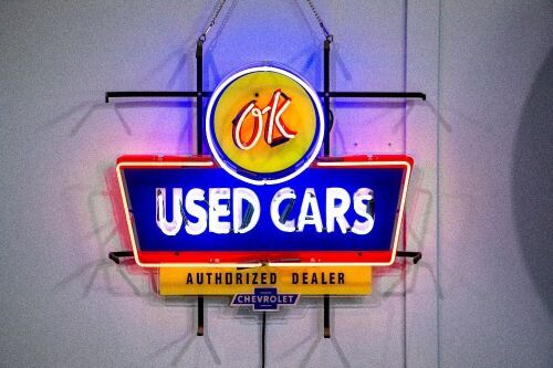 NEON SIGN: A modern 'OK Used Cars' neon sign, approx 40cm high, 60cm wide