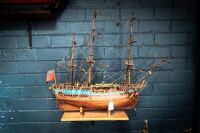MODEL SHIP: A timber c1700s Royal Navy ship model, two mast with British Ensign flag (name unknown) on base, 63cm high from base, 75cm wide - 2