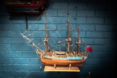 MODEL SHIP: A timber c1700s Royal Navy ship model, two mast with British Ensign flag (name unknown) on base, 63cm high from base, 75cm wide