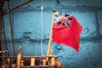 MODEL SHIP: A timber c1700s Royal Navy ship model, two mast with British Ensign flag (name unknown) on base, 63cm high from base, 75cm wide - 6