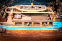 MODEL SHIP: A timber c1700s Royal Navy ship model, two mast with British Ensign flag (name unknown) on base, 63cm high from base, 75cm wide - 7