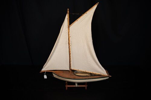 MODEL BOAT: A timber sail boat model on base, 84cm high from base, 73cm wide