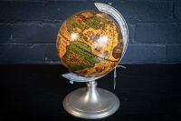 DESK GLOBE: A Marinoni (Italy) renaissance style desk world globe in pewter, 34cm high