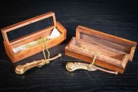 WHISTLES: Two modern Boatswain's whistles each in fitted timber boxes, both 13cm long