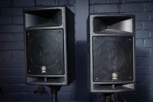 YAMAHA SPEAKERS: A pair of Yamaha Stagepas 300 portable all-in-one 300 watt public address sound system speakers on stands