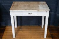 TABLE: One small rustic looking table with one drawer, mostly painted white, 80cm long, 76cm high & 56cm deep
