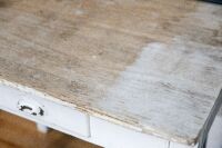TABLE: One small rustic looking table with one drawer, mostly painted white, 80cm long, 76cm high & 56cm deep - 2