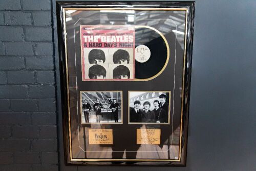 THE BEATLES: A Beatles display piece, includes copy of 'Hard Days Night' LP, two b/w photos and two plaques with band information, 100cm high, 80cm wide