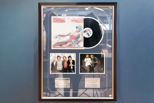ROLLING STONES: A Rolling Stones display piece, includes copy of 'Made in the Shade' LP, two photos and two plaques with band information, 100cm high, 80cm wide