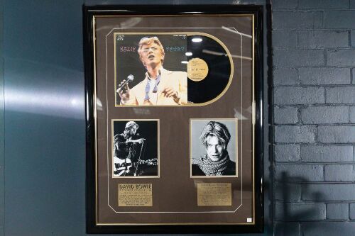 DAVID BOWIE: A David Bowie display piece, includes copy of 'Golden Years' LP, two b/w photos and two plaques with performer information, 100cm high, 80cm wide