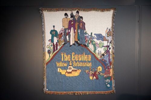 THE BEATLES: A large Beatles tapestry rug featuring 'Yellow Submarine' artwork, 170cm high, 140cm wide