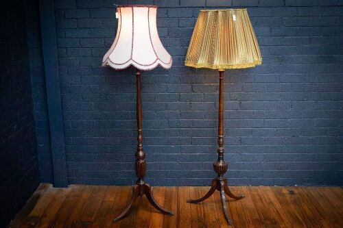 LAMPS: Two timber standing lamps with brass claw feet & fabric shades, tallest 175cm