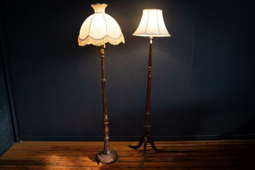LAMPS: Two timber standing lamps with fabric shades, one with brass claw feet, tallest 170cm high