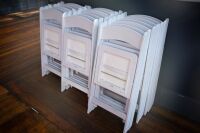 CHAIRS: Twenty white folding chairs
