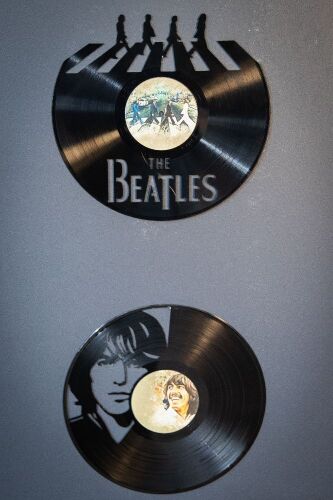 THE BEATLES: Two Beatles carved LP records display pieces, one featuring band carving and one with George Harrison carving