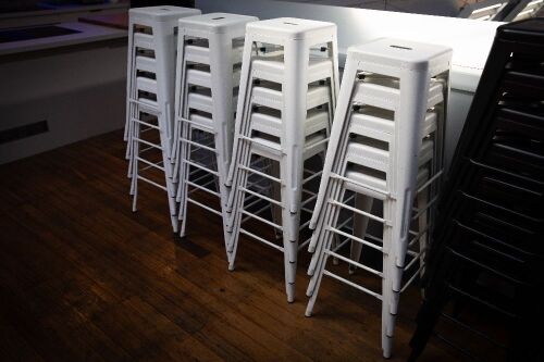 STOOLS: Twenty white steel stools, most 76cm high
