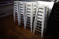 STOOLS: Twenty white steel stools, most 76cm high