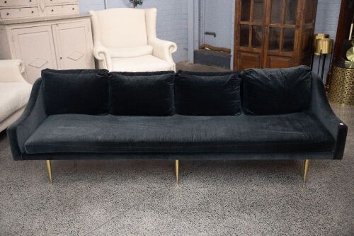 COUCH: A long black cloth four person couch, approx 230cm long