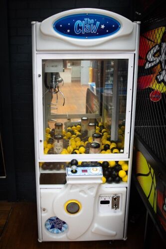 THE CLAW: A 'The Claw' aim & pick amusement machine, made by Coinopsolutions (Australia), appears functional