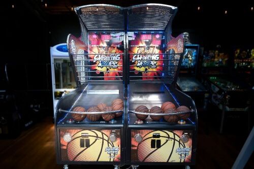 SHOOTING HOOPS: A 'c2022 Shooting Hoops' basketball amusement machine, made by Sega, appears functional