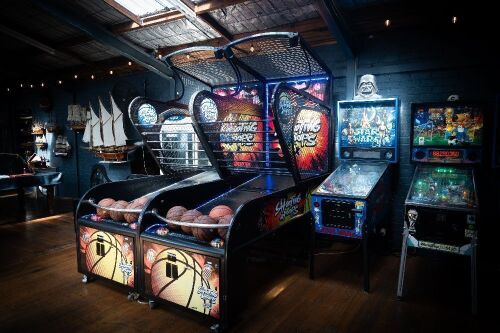 SHOOTING HOOPS: A 'c2022 Shooting Hoops' basketball amusement machine, made by Sega, appears functional