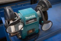 WORK BENCH: A metal work bench, 100cm high, 180cm wide, 47cm deep with two bolted on tools, a Makita GB602 six inch bench grinder and vice - 3