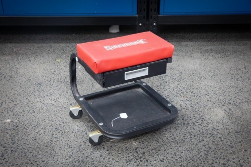 ROLLING SEAT: A Sidchrome rolling creeper seat with one drawer