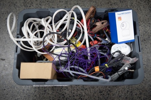 ELECTRICAL: A tub of assorted mostly automotive power chargers, cables, batteries, wires etc