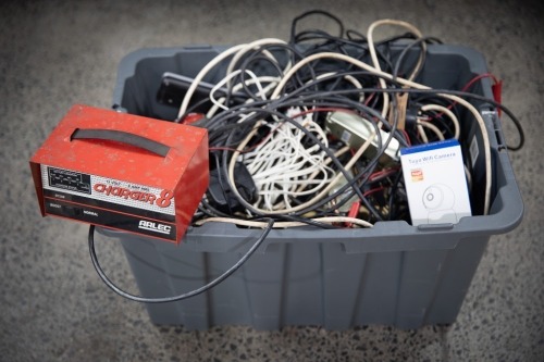 ELECTRICAL: A tub of assorted mostly automotive power chargers, cables, batteries, wires etc