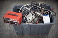 ELECTRICAL: A tub of assorted mostly automotive power chargers, cables, batteries, wires etc